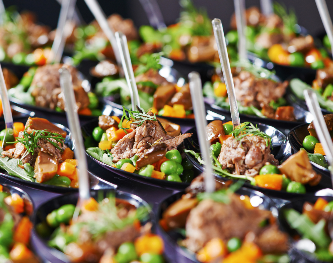 Buffet-style event catering spread with canapés and platters