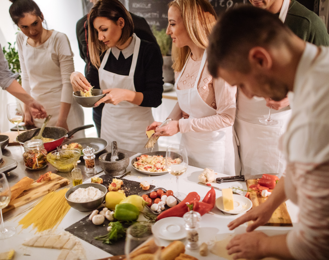 Chefs preparing live cooking experience for event guests